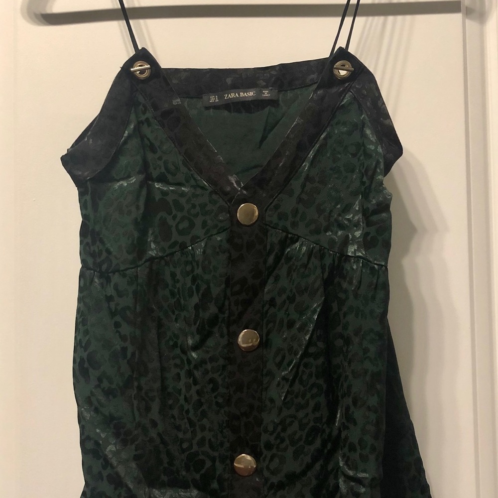 Printed green tank with gold accents.